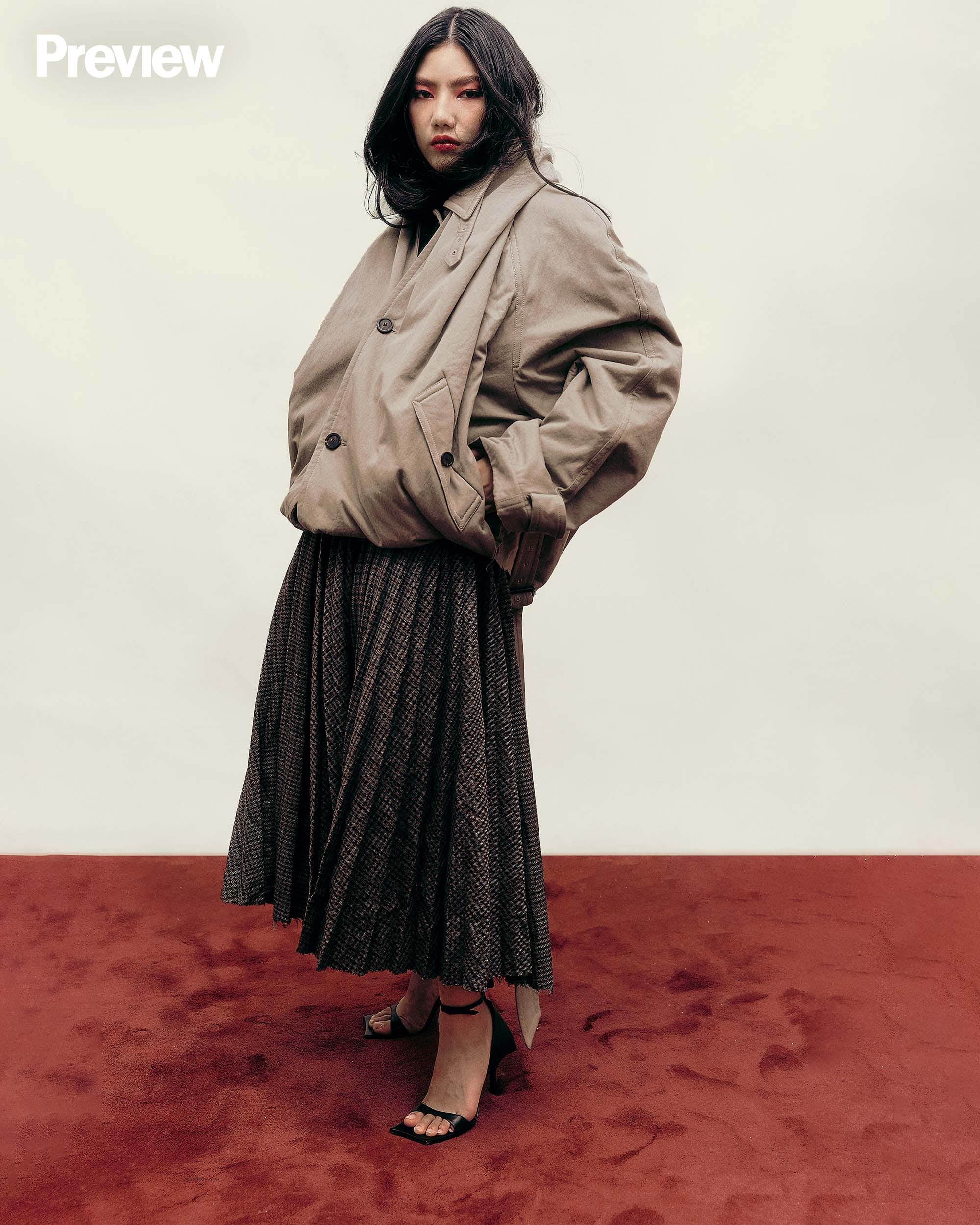 ON FRANCHESKA: Hooded trench - Dark beige/Black, P263,500. Pleated skirt - Khaki/Navy, P242,500. Hourglass sandal, P82,500, BALENCIAGA, Greenbelt 4.